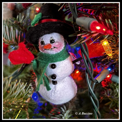 Hey, Mr Snowman, don't get too close to those hot lights!